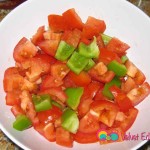 Chop the tomatoes and green bell pepper.
